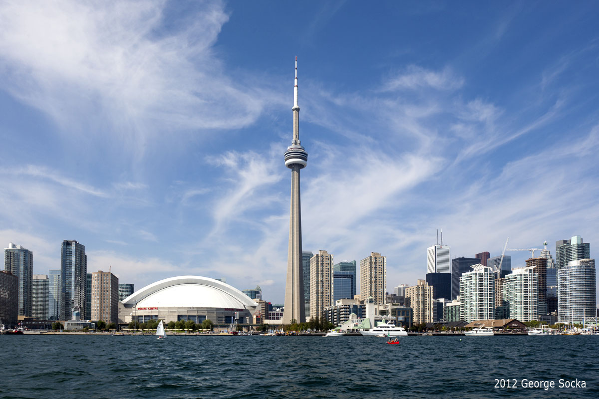 Toronto waterfront skyline with the CN Tower and Rogers Centre over the harbour, Canada